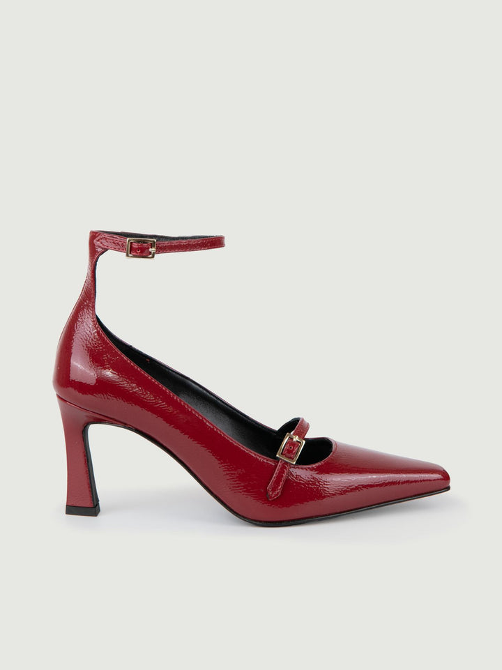 DÉCOLLETÉ CON CINTURINO IN VERNICE ROSSA.