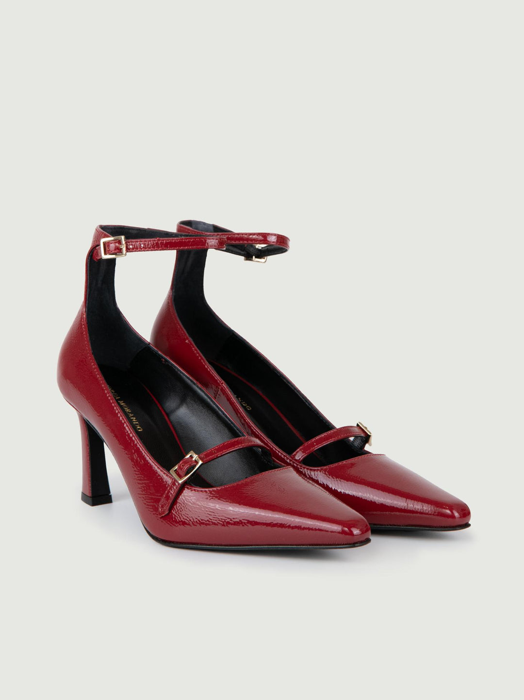 DÉCOLLETÉ CON CINTURINO IN VERNICE ROSSA.