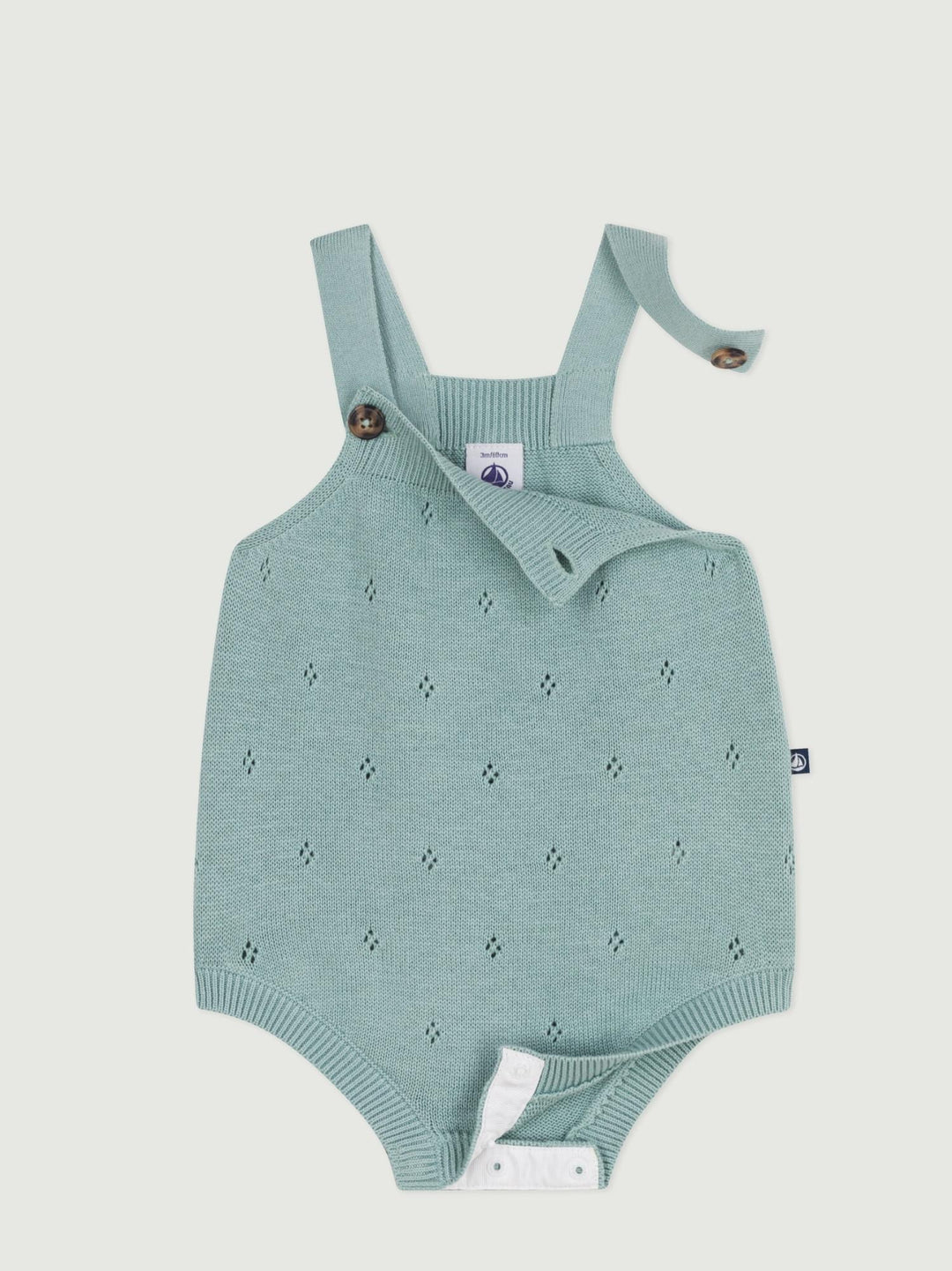 Pagliaccetto neonato in maglia con spalline