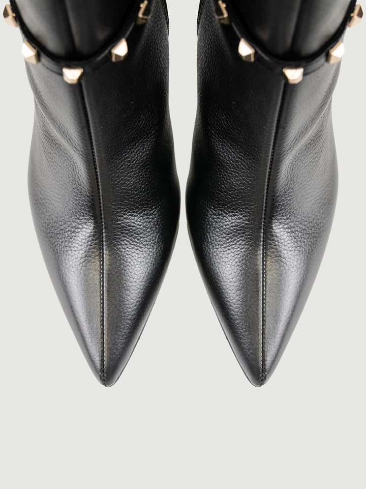 TRONCHETTO IN PELLE NERO CON BORCHIE