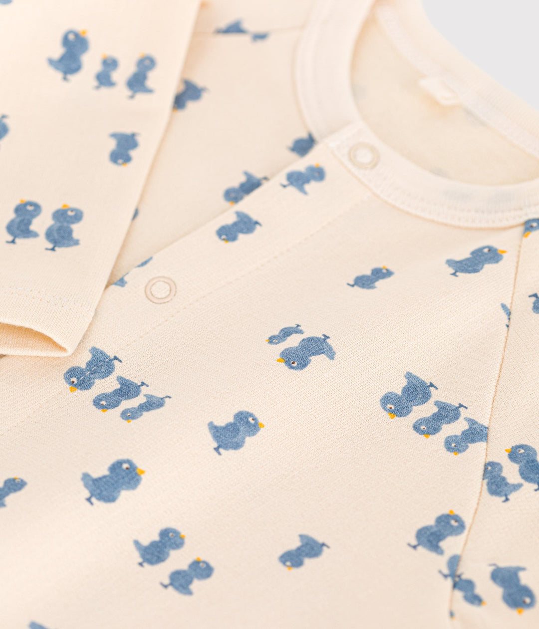 Tutina  in tessuto felpato con stampa pulcini