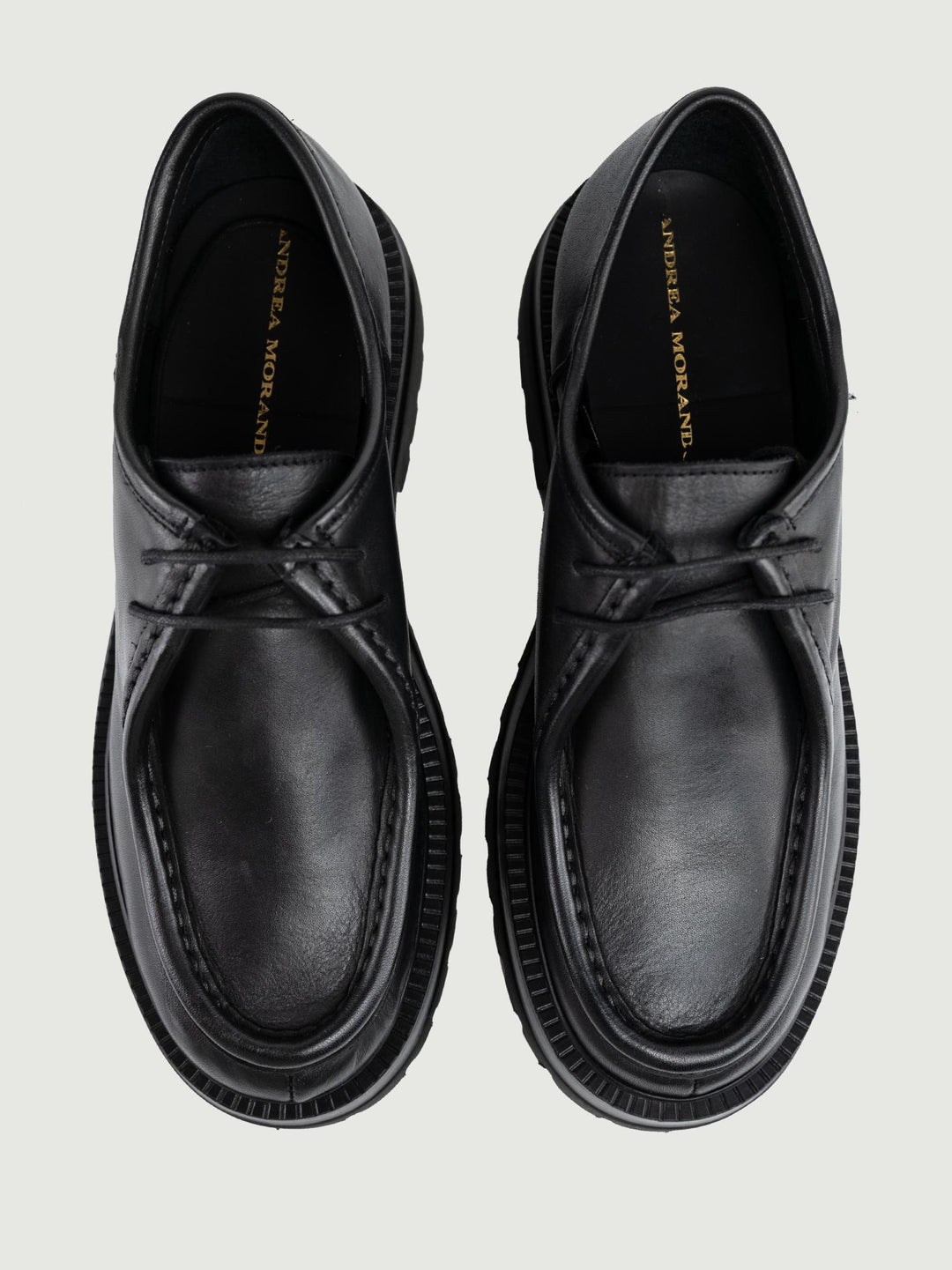 STRINGATA IN PELLE NERA CON MAXI PARA GRENOBLE 01 ANDREA MORANDO 