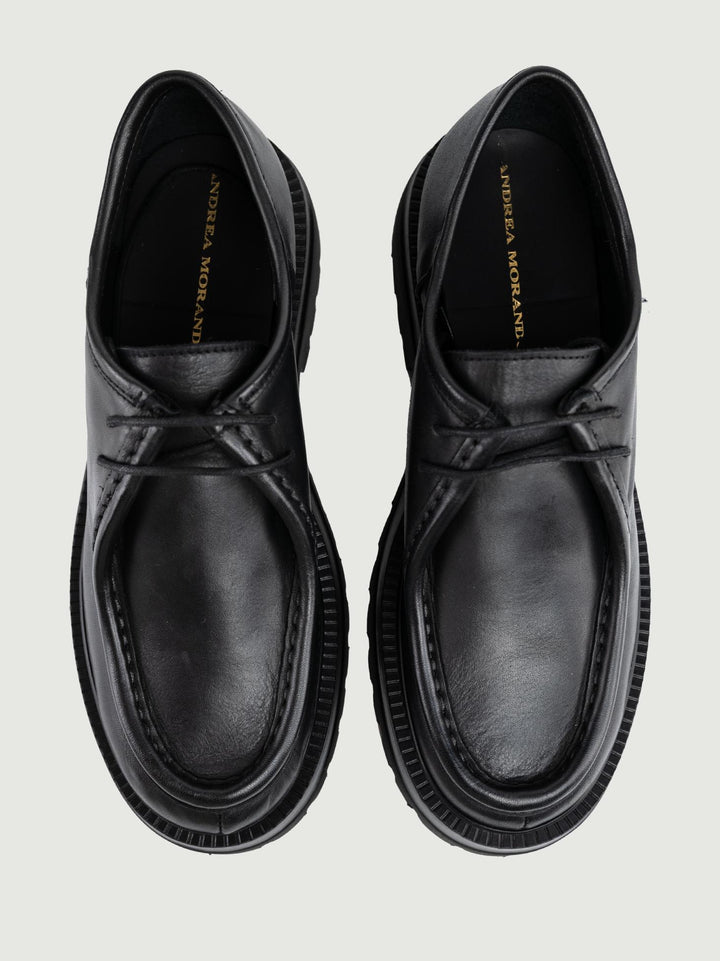 STRINGATA IN PELLE NERA CON MAXI PARA GRENOBLE 01 ANDREA MORANDO 