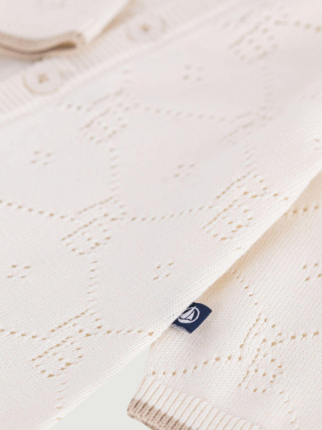 Tutina traforata in cotone A0F37 01 PETIT BATEAU 