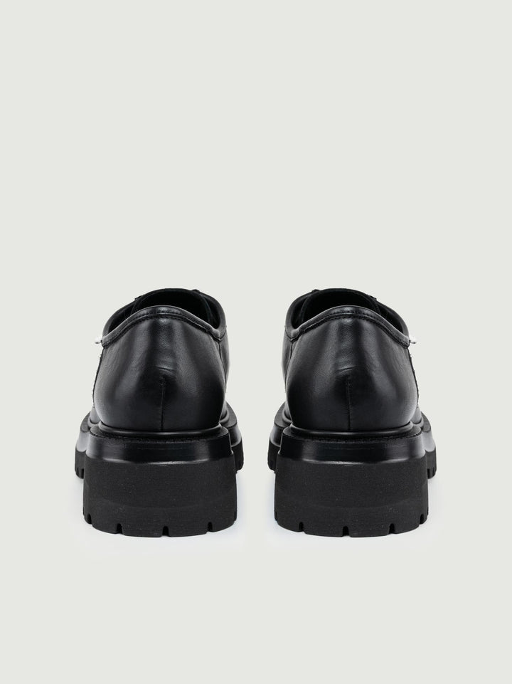 STRINGATA IN PELLE NERA CON MAXI PARA GRENOBLE 01 ANDREA MORANDO 