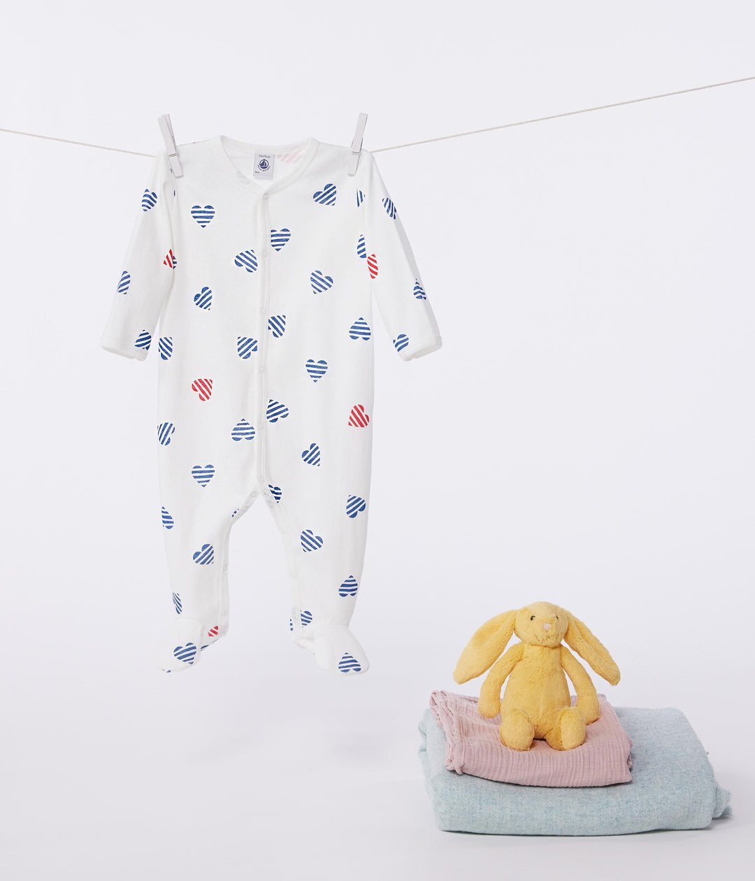 Pigiama in cotone a righe con cuori neonato